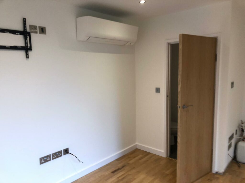 Air conditioning unit in bespoke garden studio